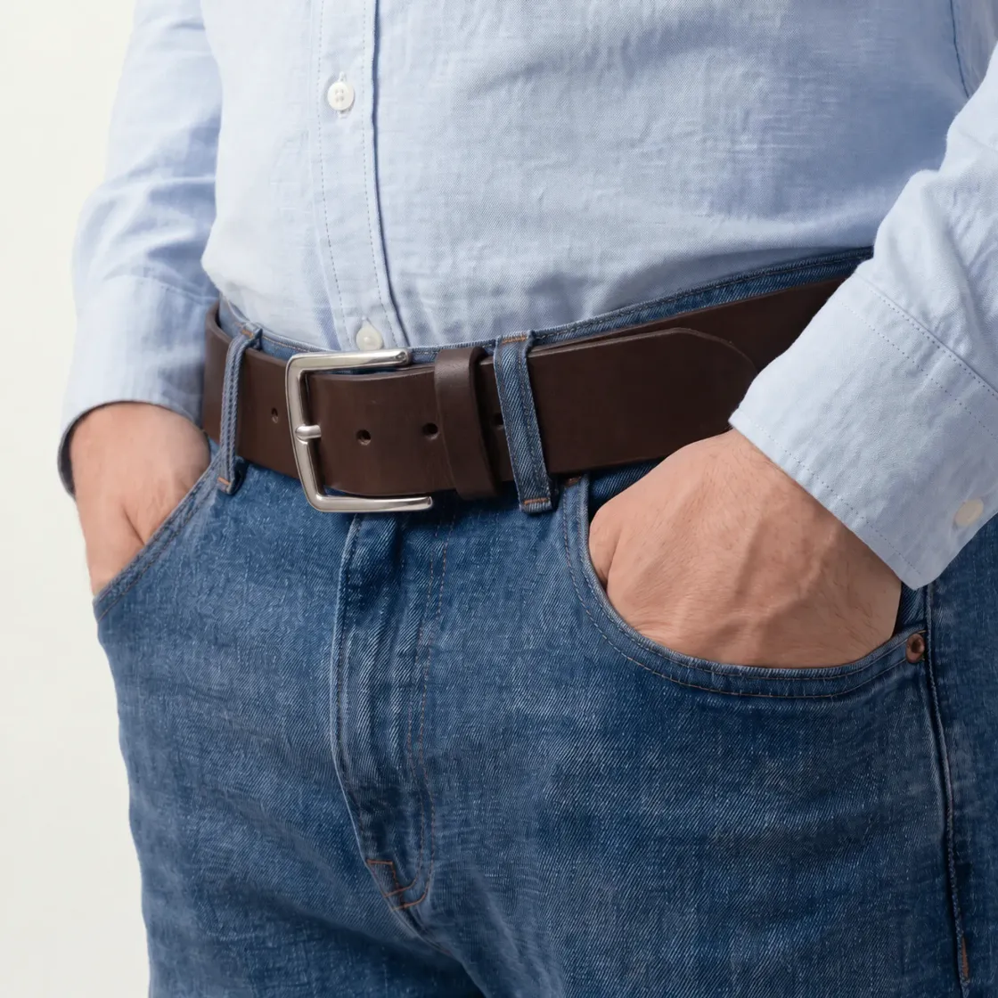 Wide dark brown 40 mm leather belt worn with blue jeans